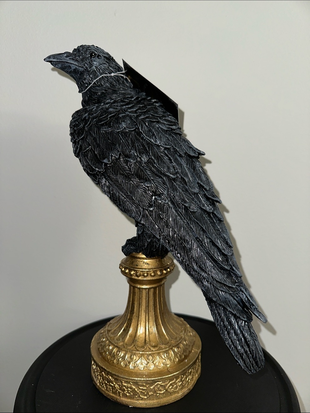 Black Decorative Raven Statue on Gold Pedestal - crow